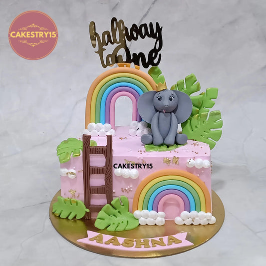 1kg eggless pineapple Halfway to One cake with elephant and rainbow for Aashna