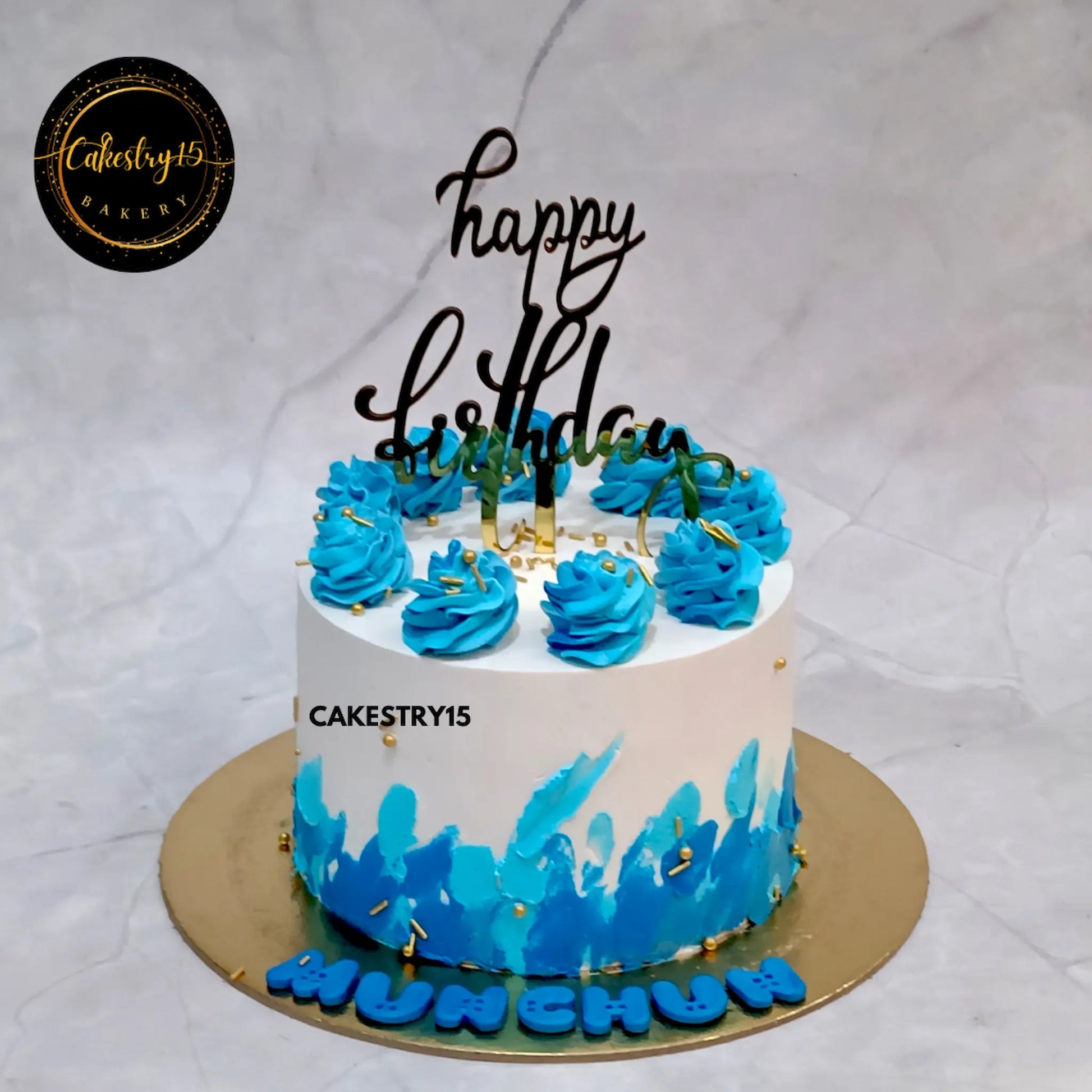 1kg chocolate birthday cake with cream rosettes and blue palette work from Cakestry15
