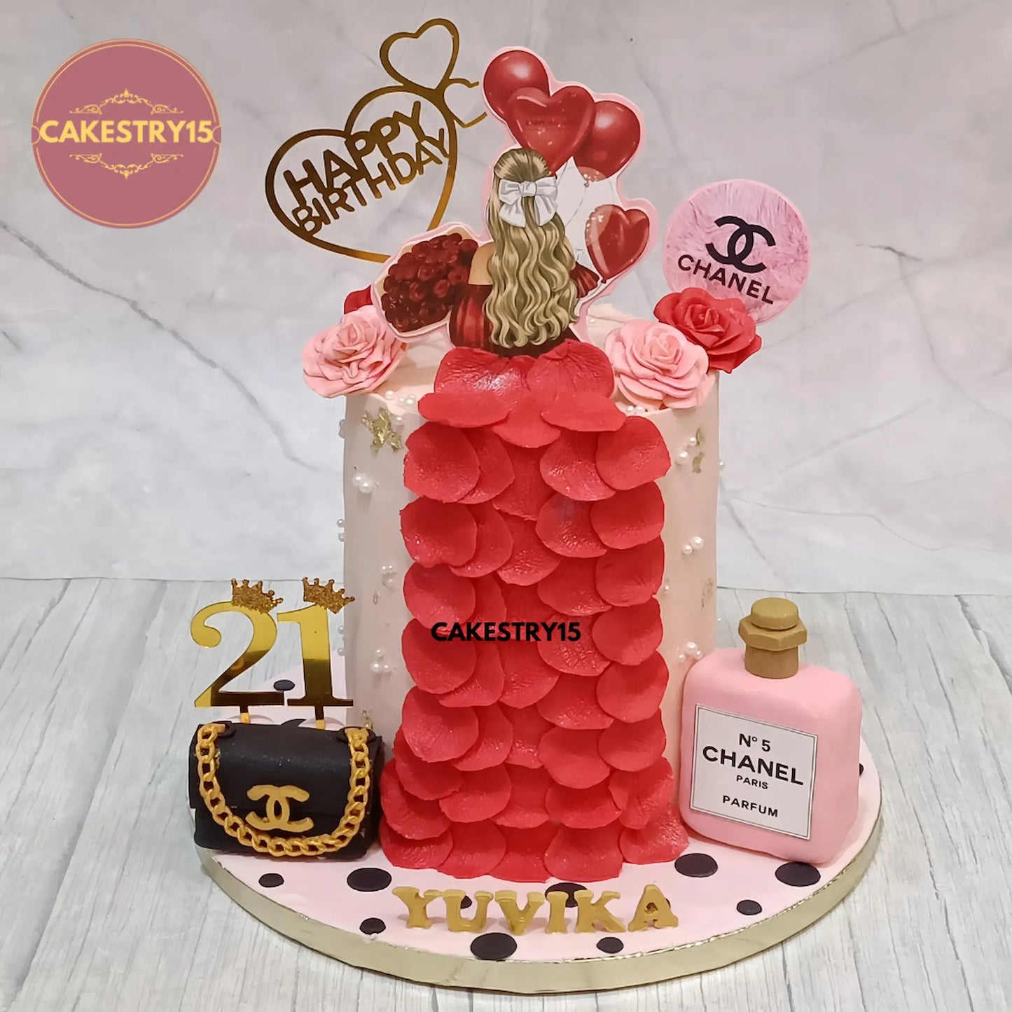 2kg chocolate ganache cake with designer fashion theme featuring Dior bag, Chanel perfume and gown design, from Cakestry15 in Noida