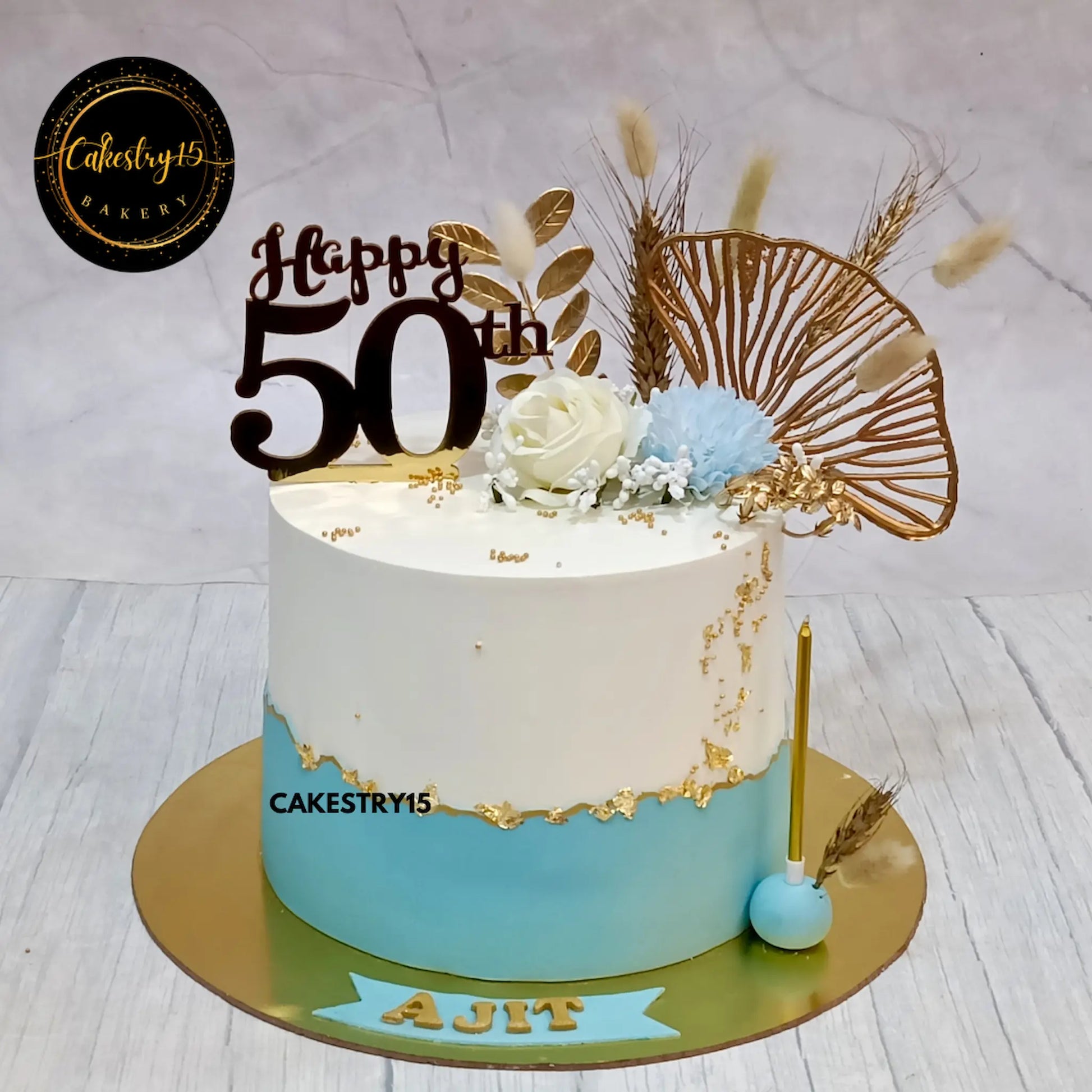 1.5kg eggless pineapple birthday cake topped with faux roses and carnations from Cakestry15