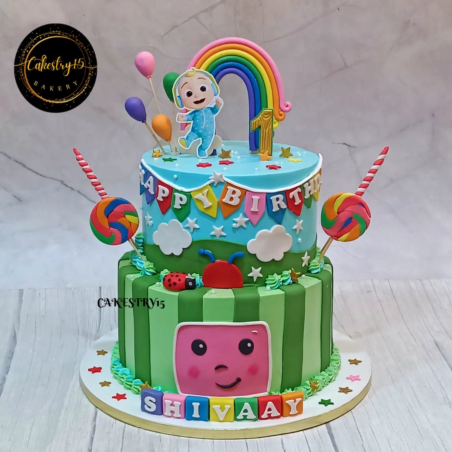 Cocomelon theme 5kg size 2 tier pineapple flavor 1st birthday Cake by cakestry15 noida,full image