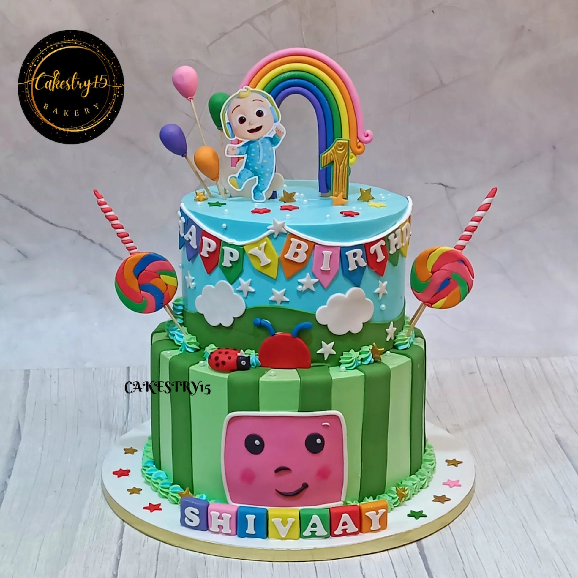 Cocomelon theme 5kg size 2 tier pineapple flavor 1st birthday Cake by cakestry15 noida,full image
