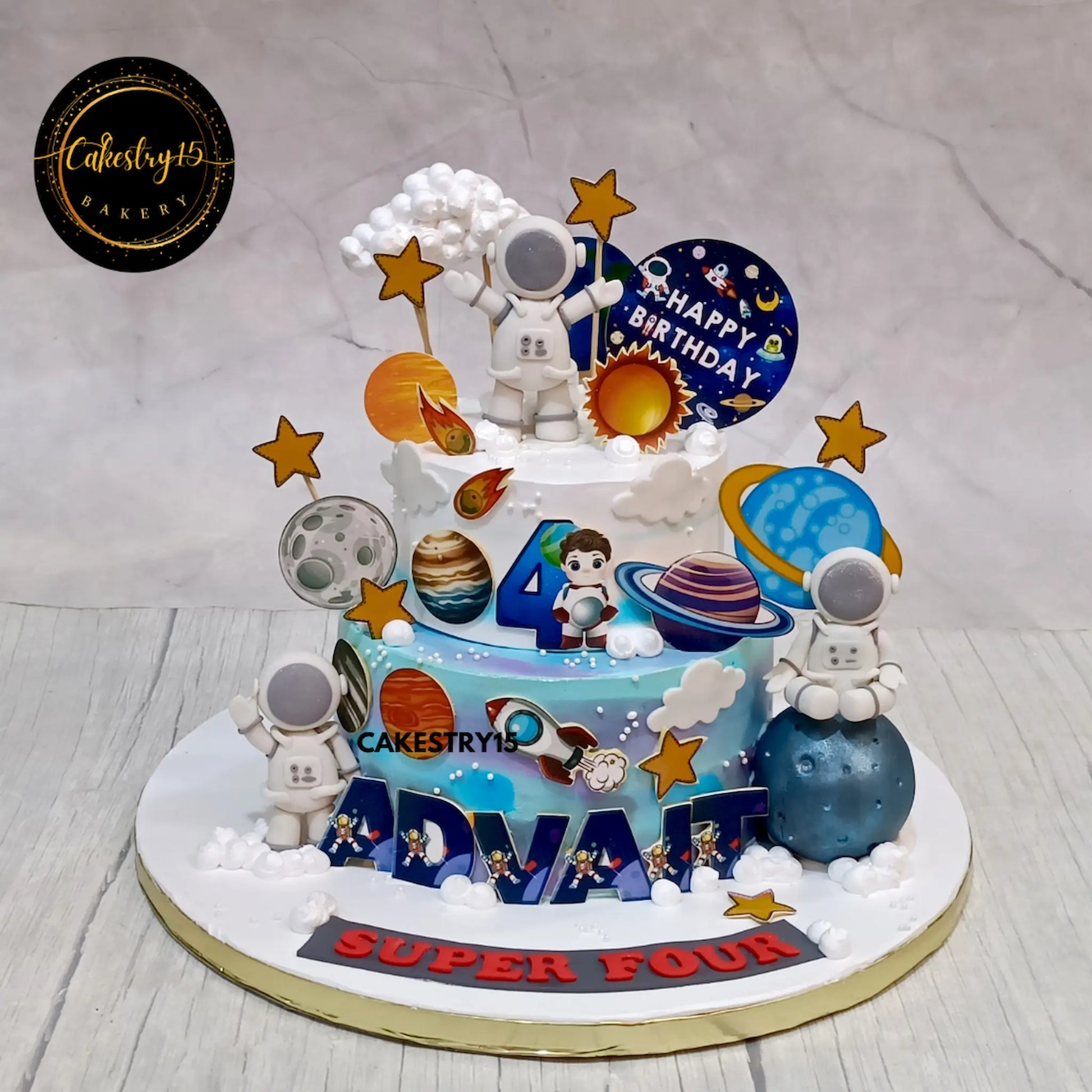 Space-themed birthday cake with astronauts, planets, and stars on a gray background for advait,4thbirthday by cakestry15