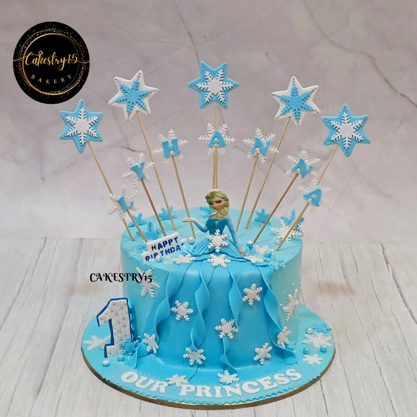 Frozen Frosty 1.5kg blueberry first birthday Cake for lyhanna in ice blue colour by cakestry15,noida,cake full image