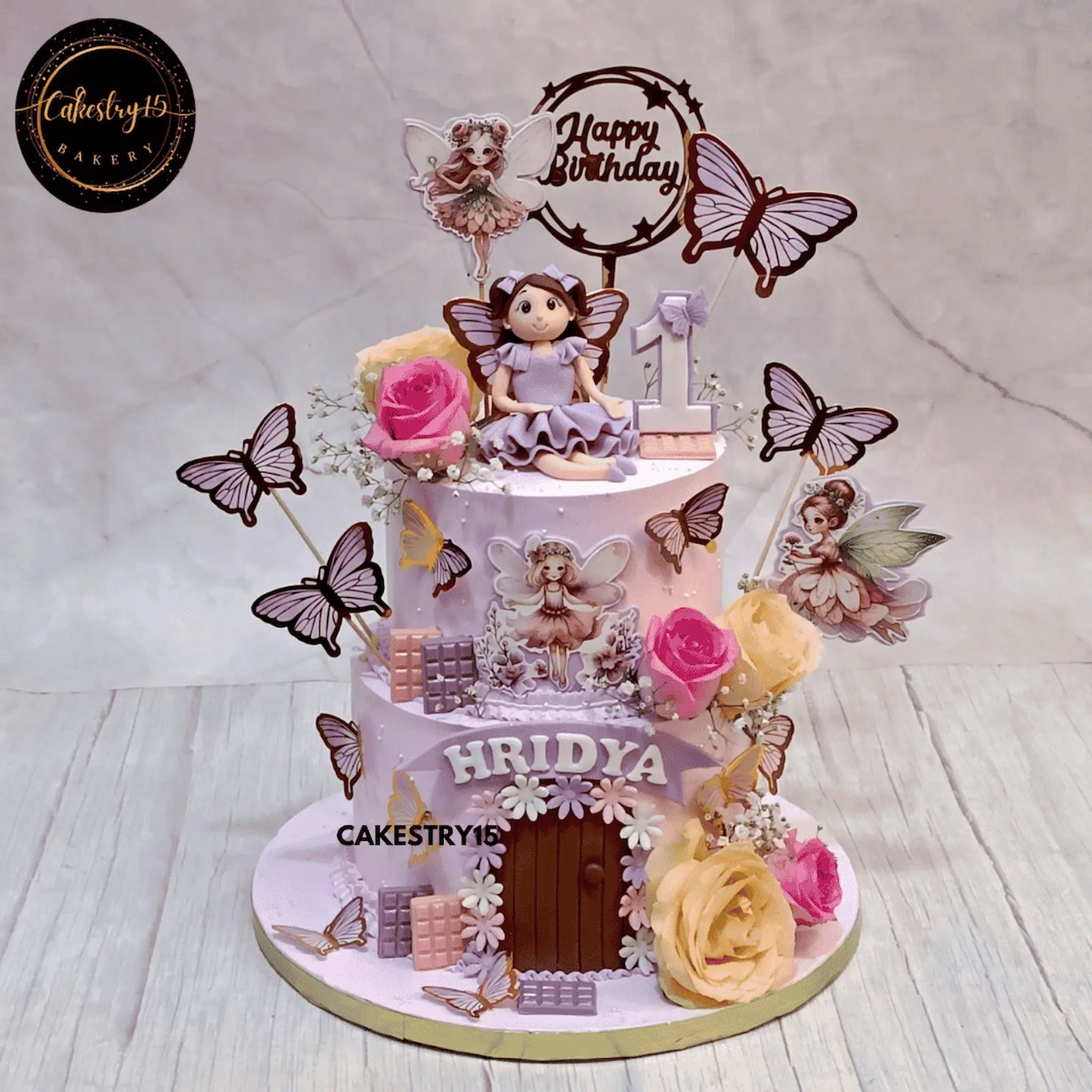 Magical Fairy in a Garden,3kg butterscotch 2 tier first birthday cake for a girl by cakestry15 noida,cake full image