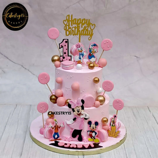 butterscotch birthday cake for Ojasvi’s 1st birthday, featuring edible Disney characters and pink decorations by cakestry15,best bakery noida