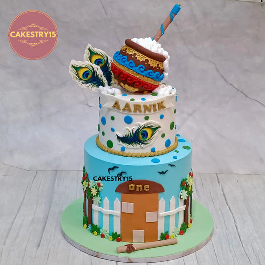 4kg 2-tier butterscotch Kanha theme birthday cake with edible peacock feathers and matka from Cakestry15