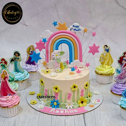 1kg choco vanilla eggless cake with rainbow, age 1 tag, stars, and princess cupcakes from Cakestry15 Noida
