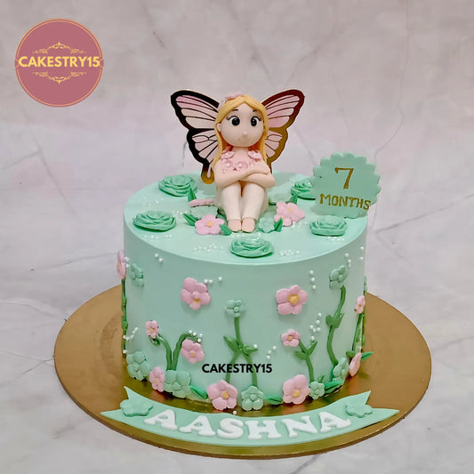 1kg blueberry angel theme birthday cake with girl figurine and fondant flowers by cakestry15 in noida