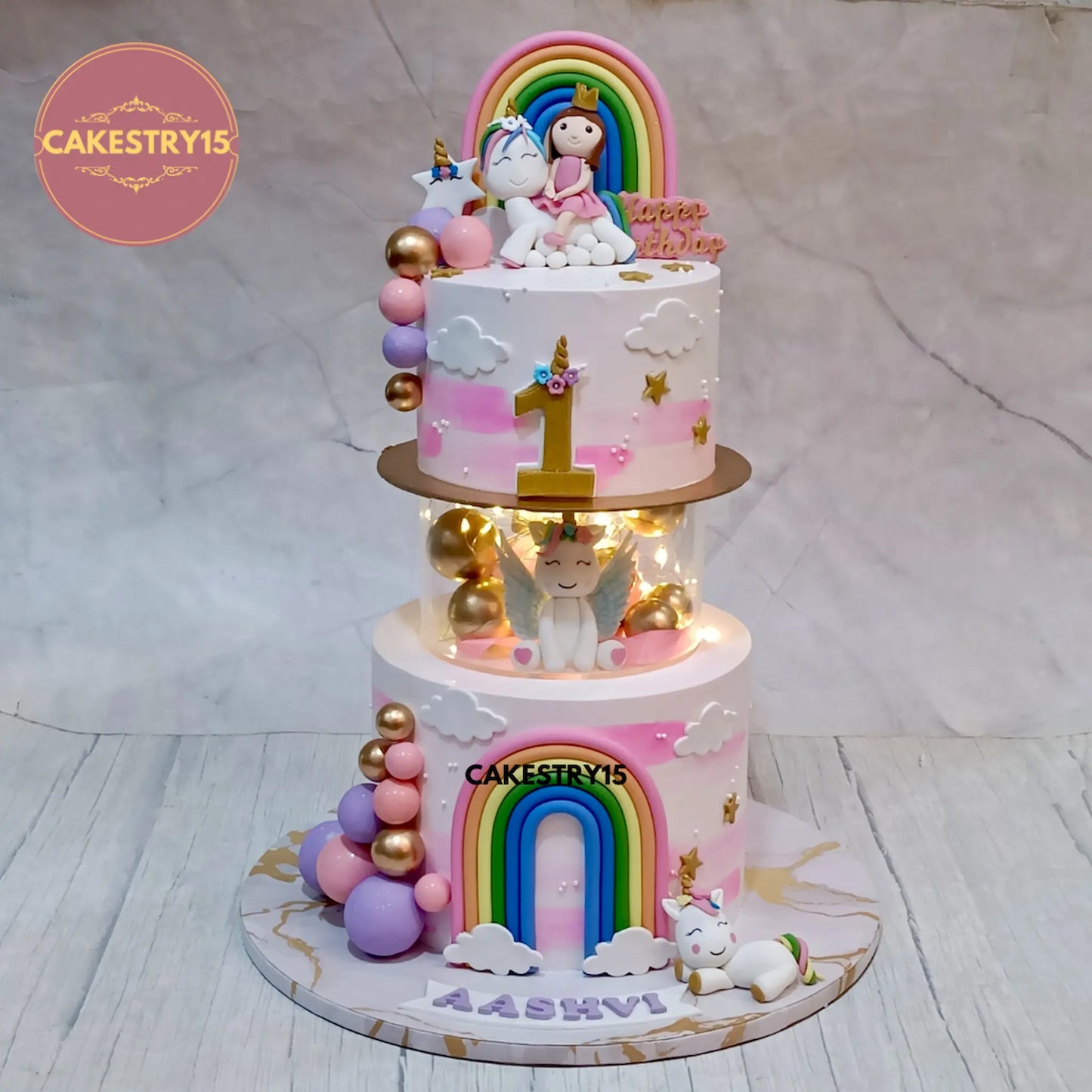 Aashvi’s 3kg choco vanilla first birthday unicorn cake with fondant rainbows and topper