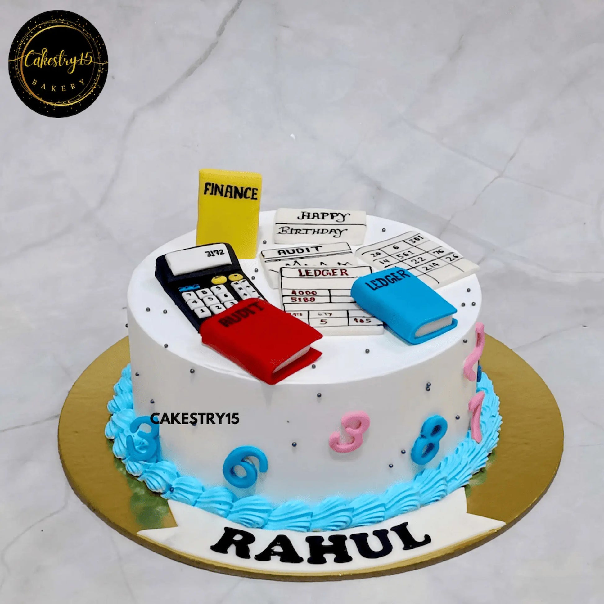 One kg pineapple birthday cake with calculator, finance books, and bills for accountant Rahul by cakestry15 ,best bakery noida