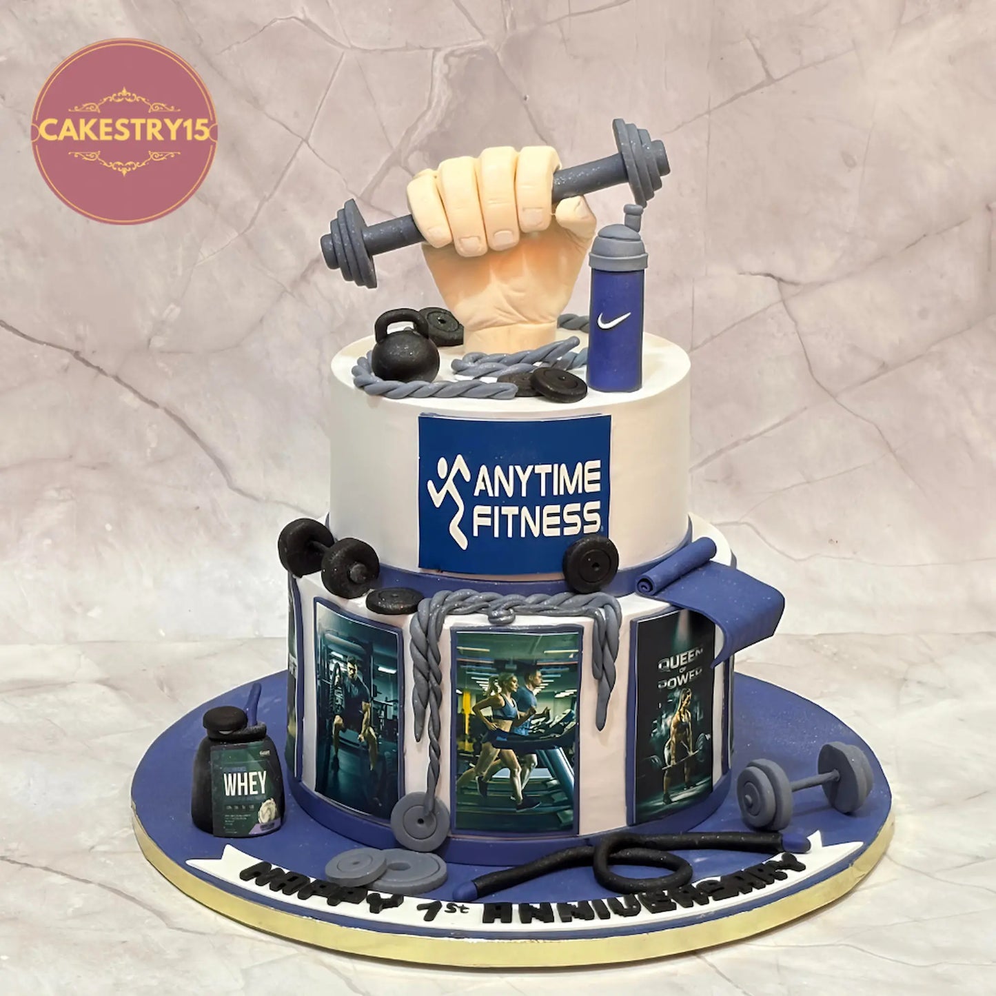 Eggless Anytime Fitness gym theme first anniversary chocolate cake with fondant barbell topper and gym elements by Cakestry15 Noida