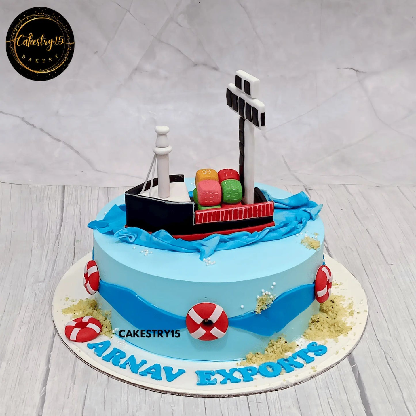 1.5kg chocolate anniversary cake with cargo ship topper and Arnav Exports branding