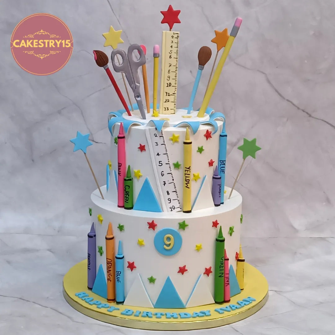 Eggless kids birthday cake with colourful art theme design and fondant stationery elements, perfect theme cake Noida celebration.