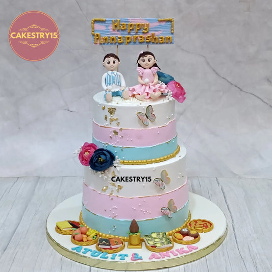 3kg 2 tier eggless pineapple Annaprashan cake with boy and girl figurine, fondant platters, and custom name from Cakestry15
