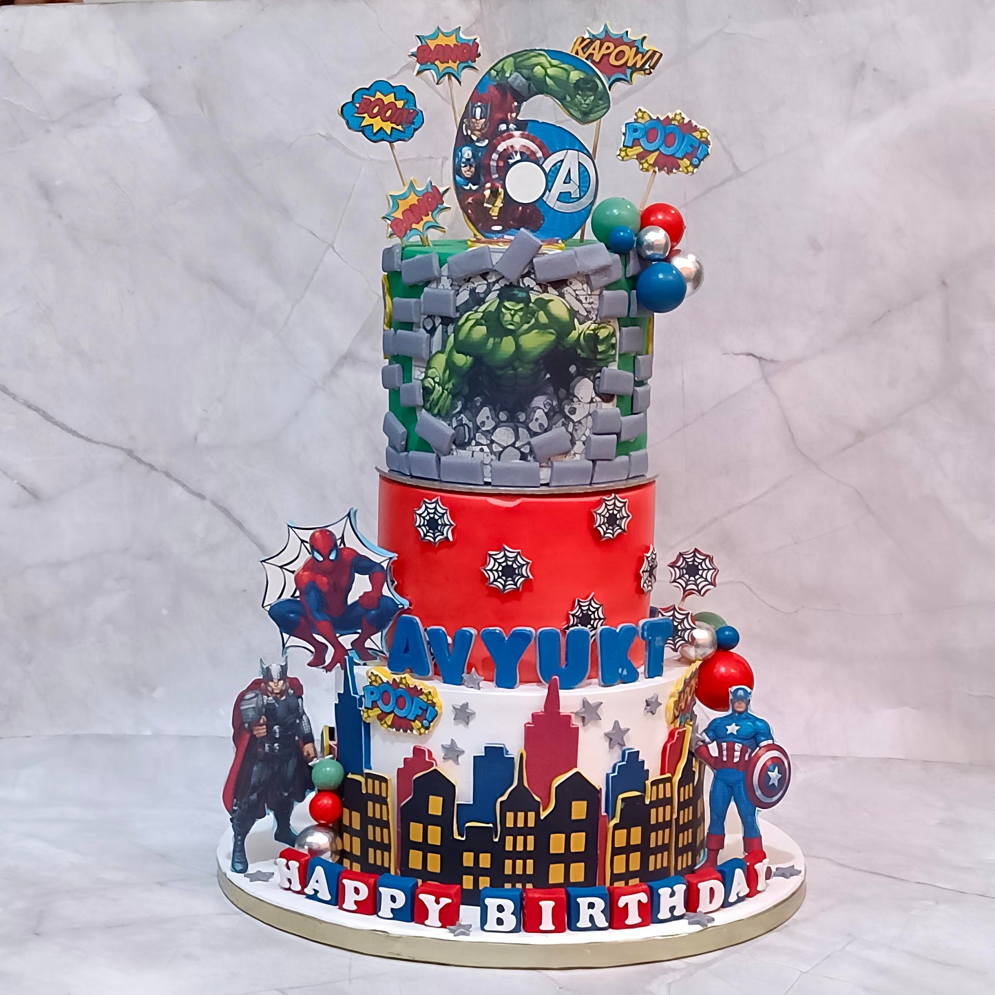 Avengers superhero kids birthday cake with Hulk, Thor and Spiderman details from an eggless cakes bakery offering a theme cake Noida.
