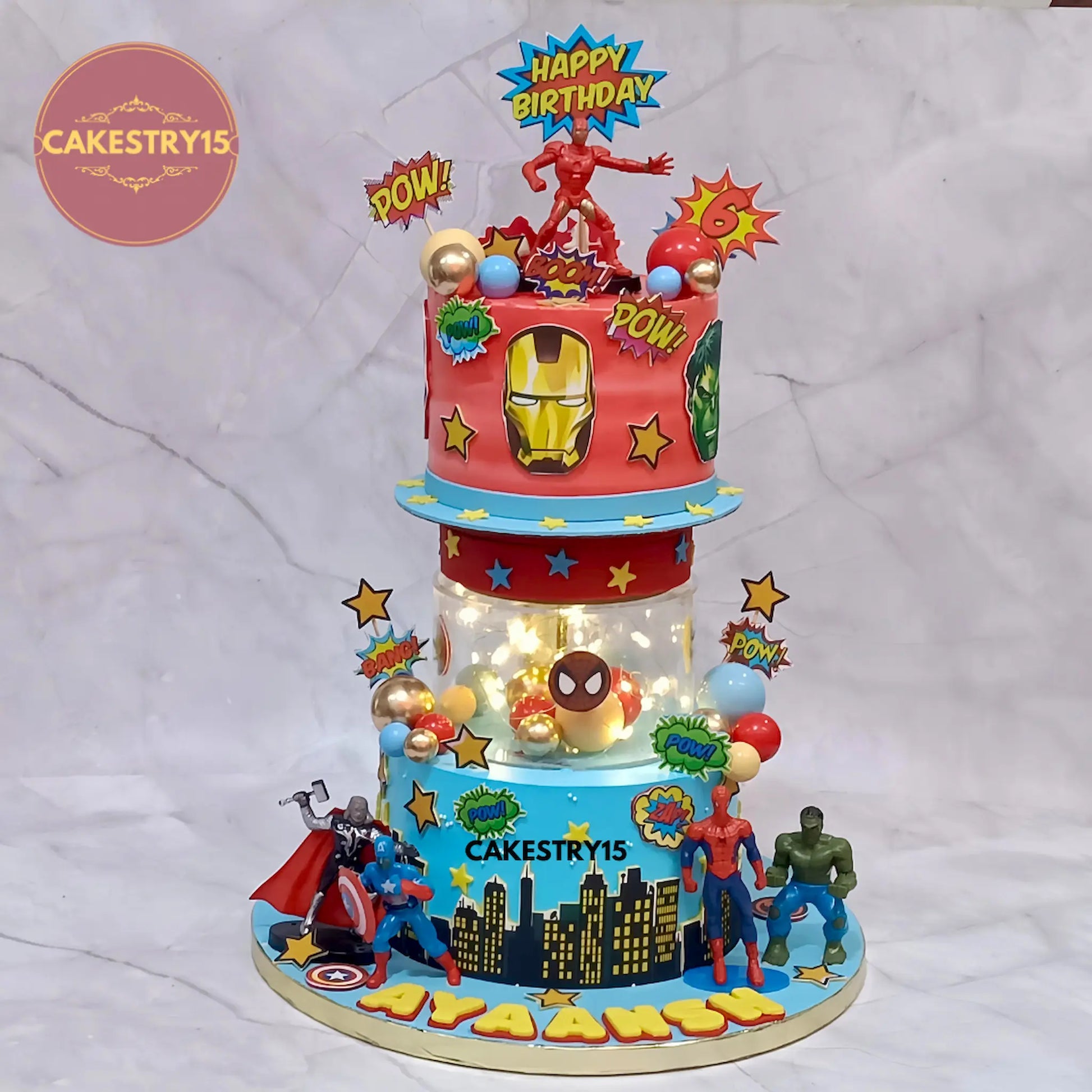 3kg Avengers theme eggless choco chips cake with rotator and superhero toys from Cakestry15 Noida