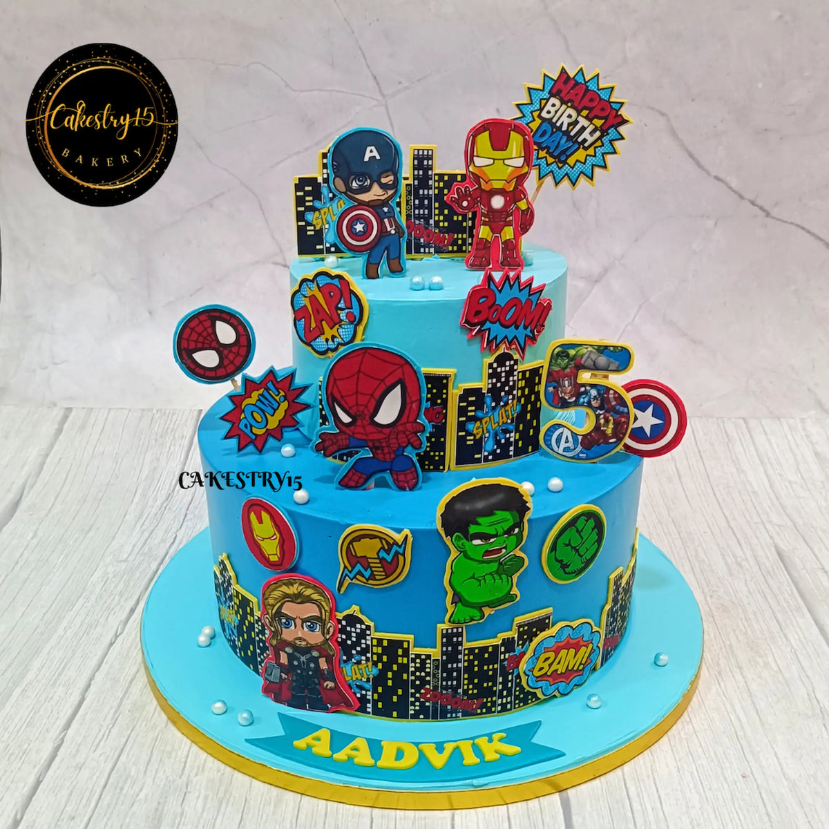 A 4kg Avengers theme pineapple cake decorated with iconic Avengers characters and colourful superhero details for Aadvik’s 5th birthday.