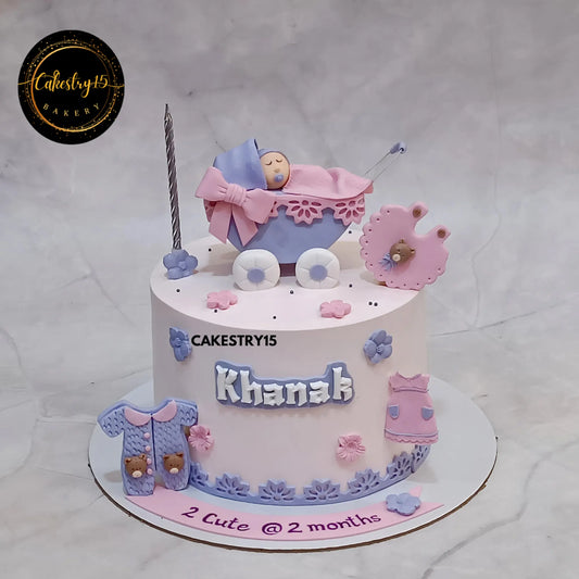 1kg pineapple cake for 2-month-old baby featuring baby in pram and fondant baby items