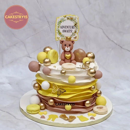 2kg chocolate teddy theme baby shower cake with fondant strips, macarons, and Adventure Awaits topper by cakestry15 in noida