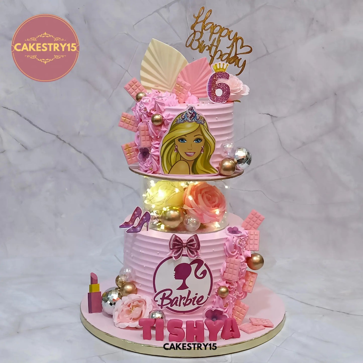 3kg black forest Barbie birthday cake with edible images, faux roses, and lights from Cakestry15 Noida