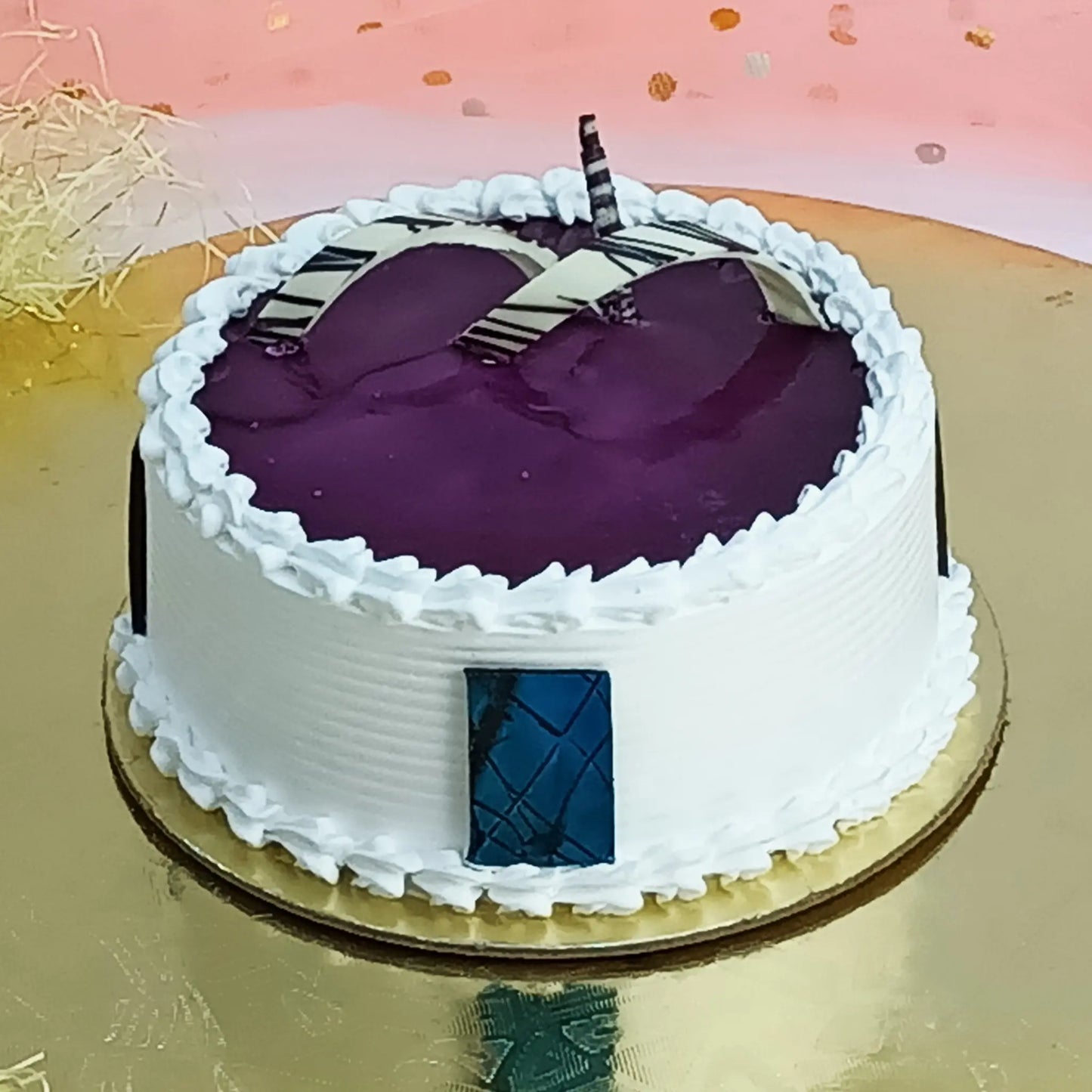 1kg eggless blueberry cake layered with filling and topped with glaze from Cakestry15