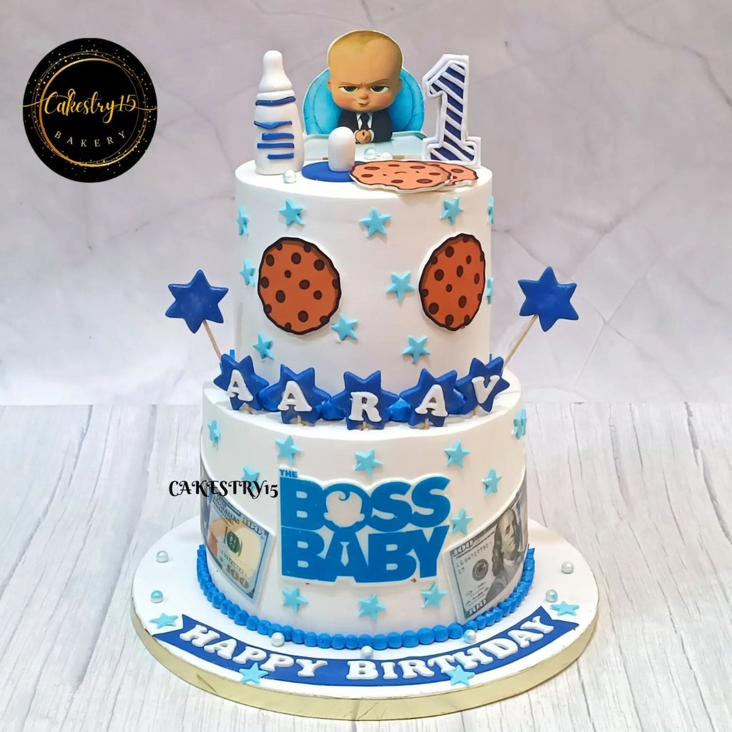 Eggless Boss Baby dollar theme first birthday cake for kids with suit design and fondant topper in Noida by Cakestry15