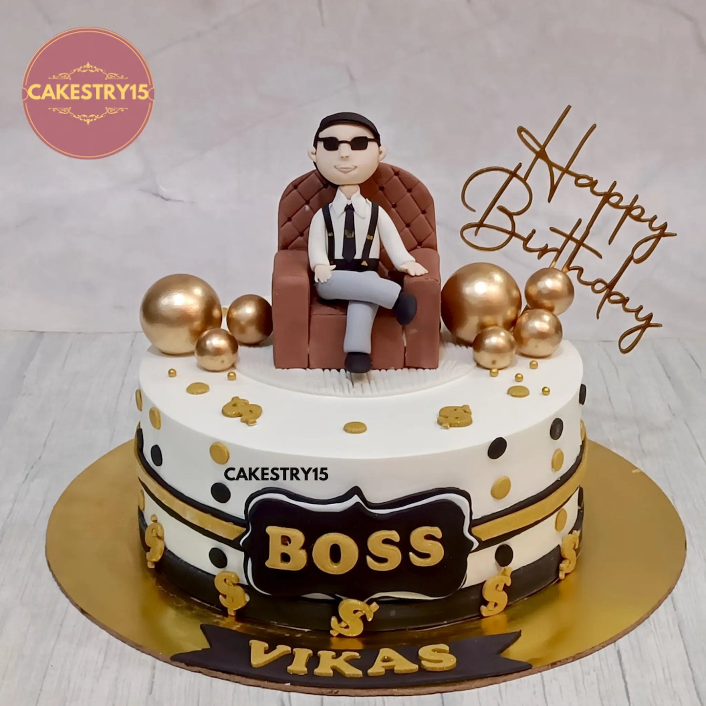 1.5kg chocolate birthday cake with sofa topper, dollar signs, and BOSS tag from Cakestry15