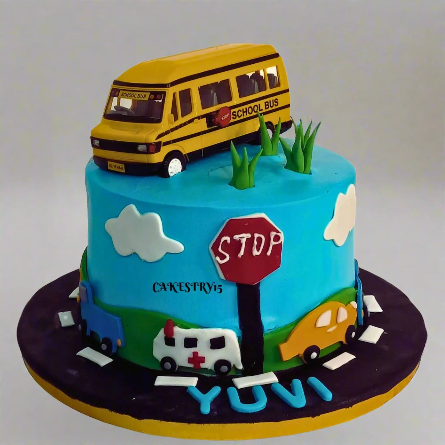 Eggless bus theme kids birthday cake with toy bus topper and choco vanilla flavour by Cakestry15 in Noida