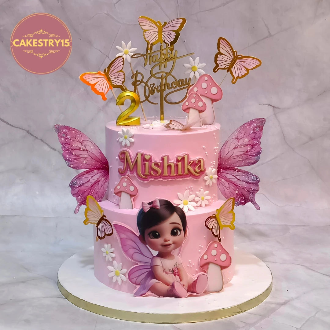 Butterfly Fairy kids birthday cake with butterfly wings, mushrooms and flowers, handcrafted as a theme cake Noida using premium eggless cakes.