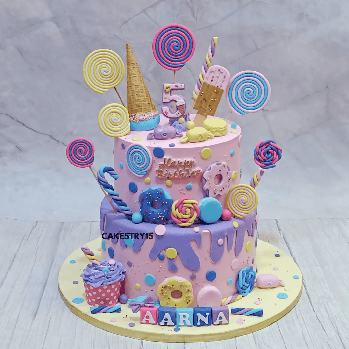 Candyland kids birthday cake with colourful sweets design, a premium theme cake Noida from eggless cakes range