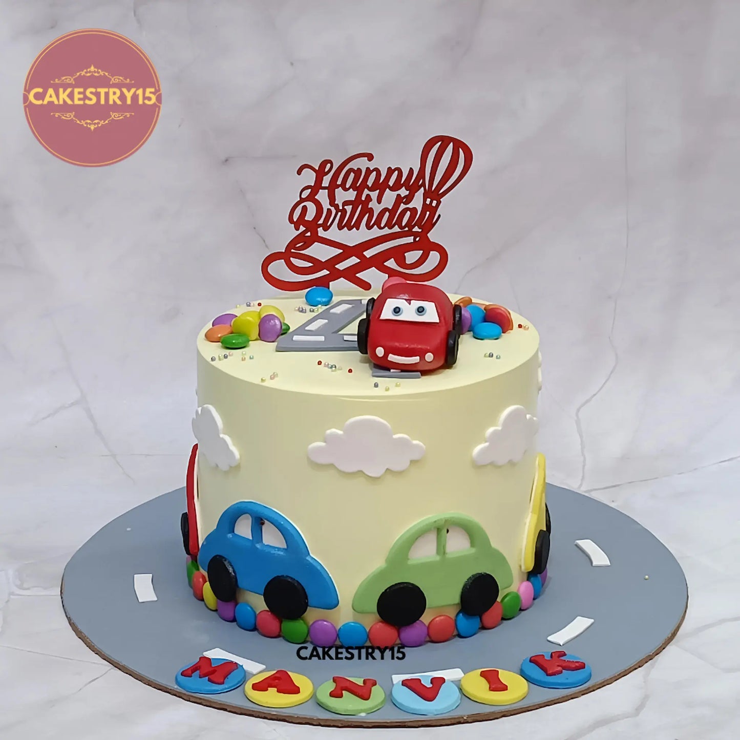 Eggless car theme 4th birthday cake for kids with fondant cars and road design by Cakestry15 in Noida