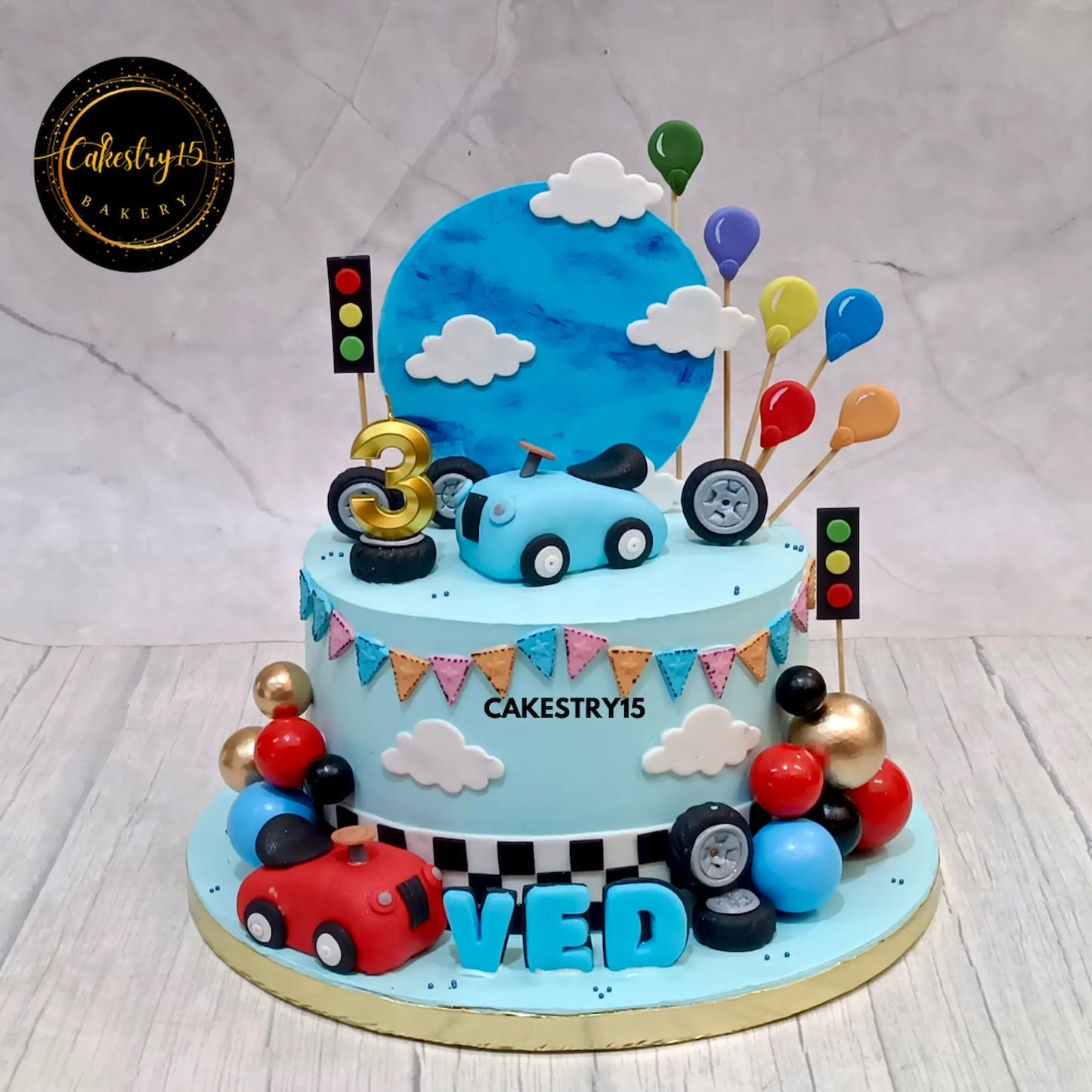 Eggless car theme kids birthday cake in choco vanilla with cars, clouds and balloons, custom made in Noida by Cakestry15