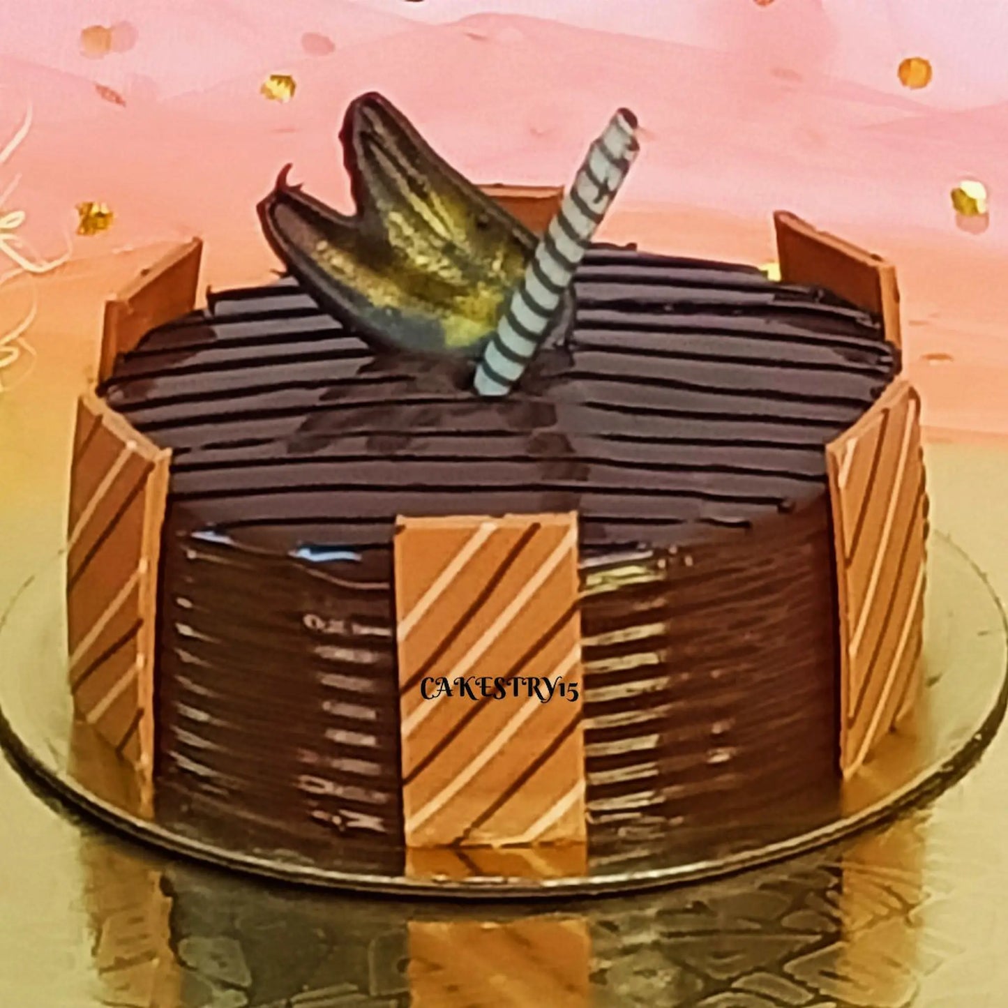 1kg eggless Belgian chocolate cake topped with rich chocolate accents from Cakestry15