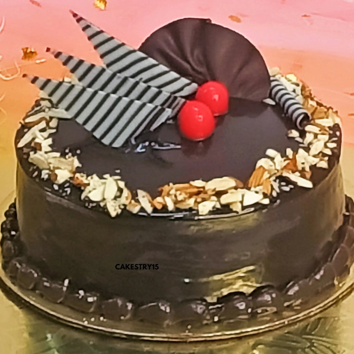 1kg chocolate almond cake topped with chocolate cigars and cherries by cakestry15 noida