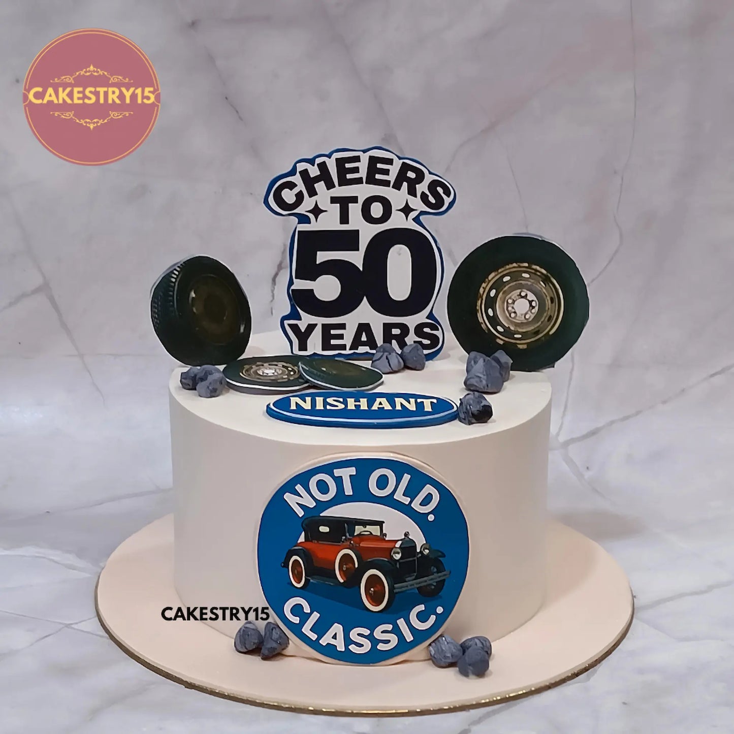 Eggless classic car theme butterscotch cake for 50th birthday with Cheers to 50 topper by Cakestry15 Noida