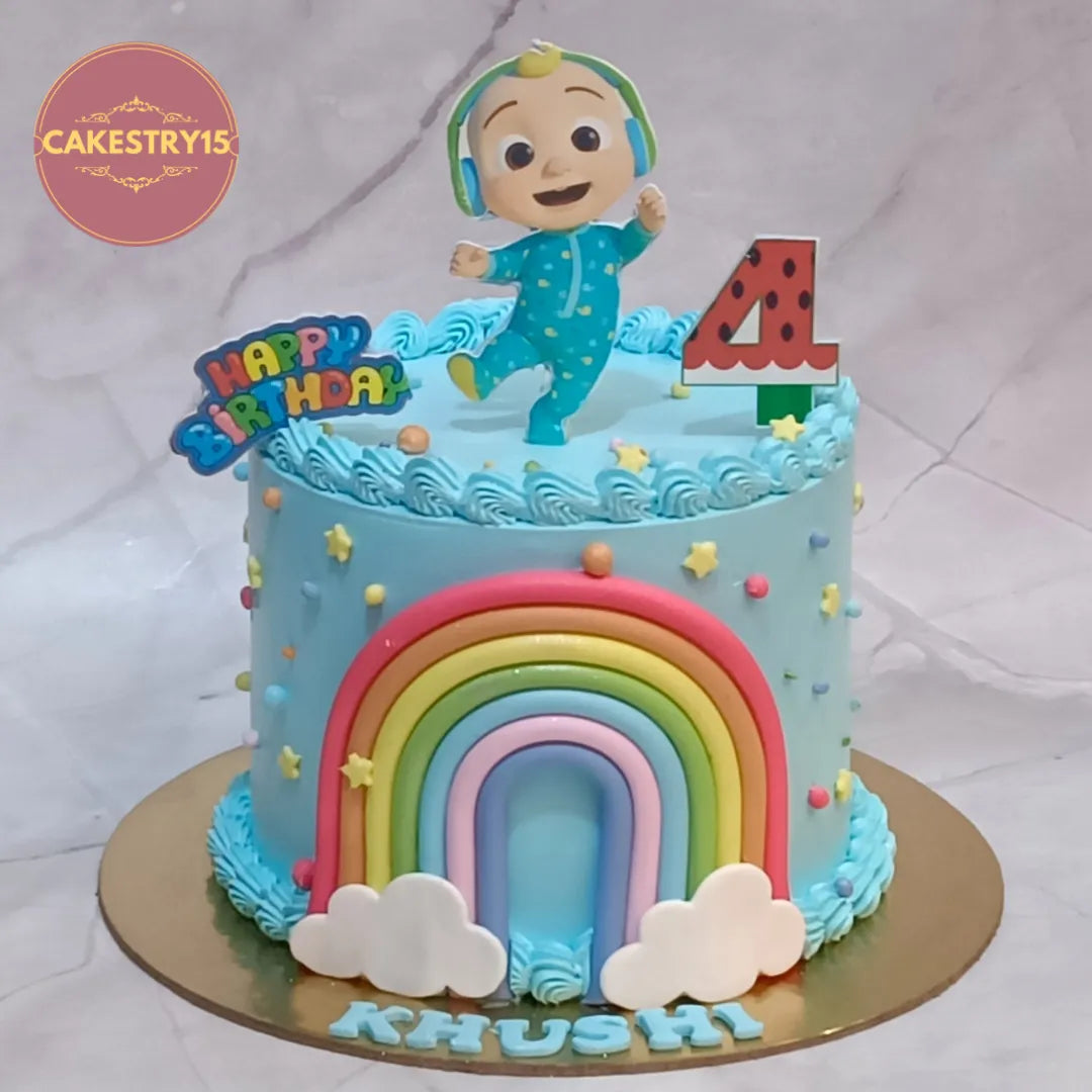 Eggless Cocomelon kids birthday cake with rainbow design for 4th birthday celebration, premium theme cake Noida.