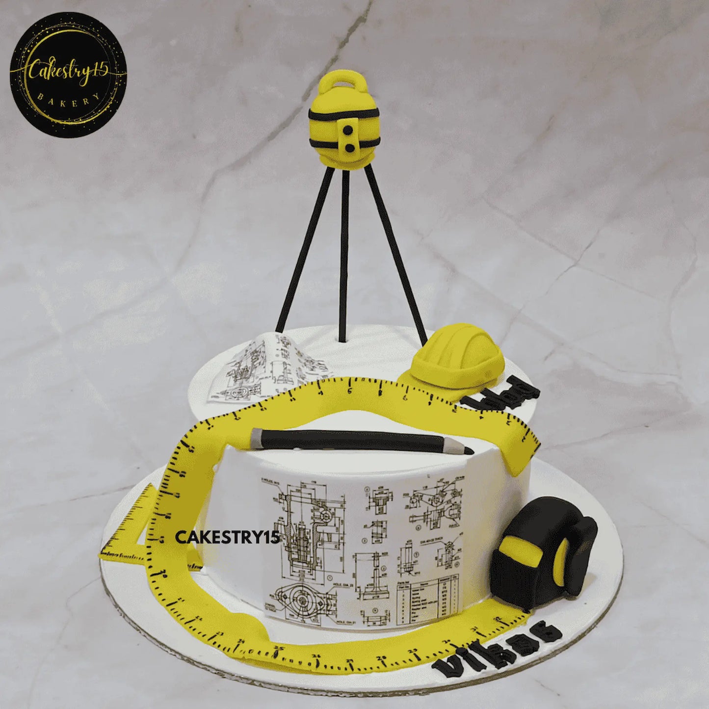 Construction theme cake with architecture and builder elements, suitable as a kids birthday cake and made with eggless cakes from a theme cake Noida bakery.