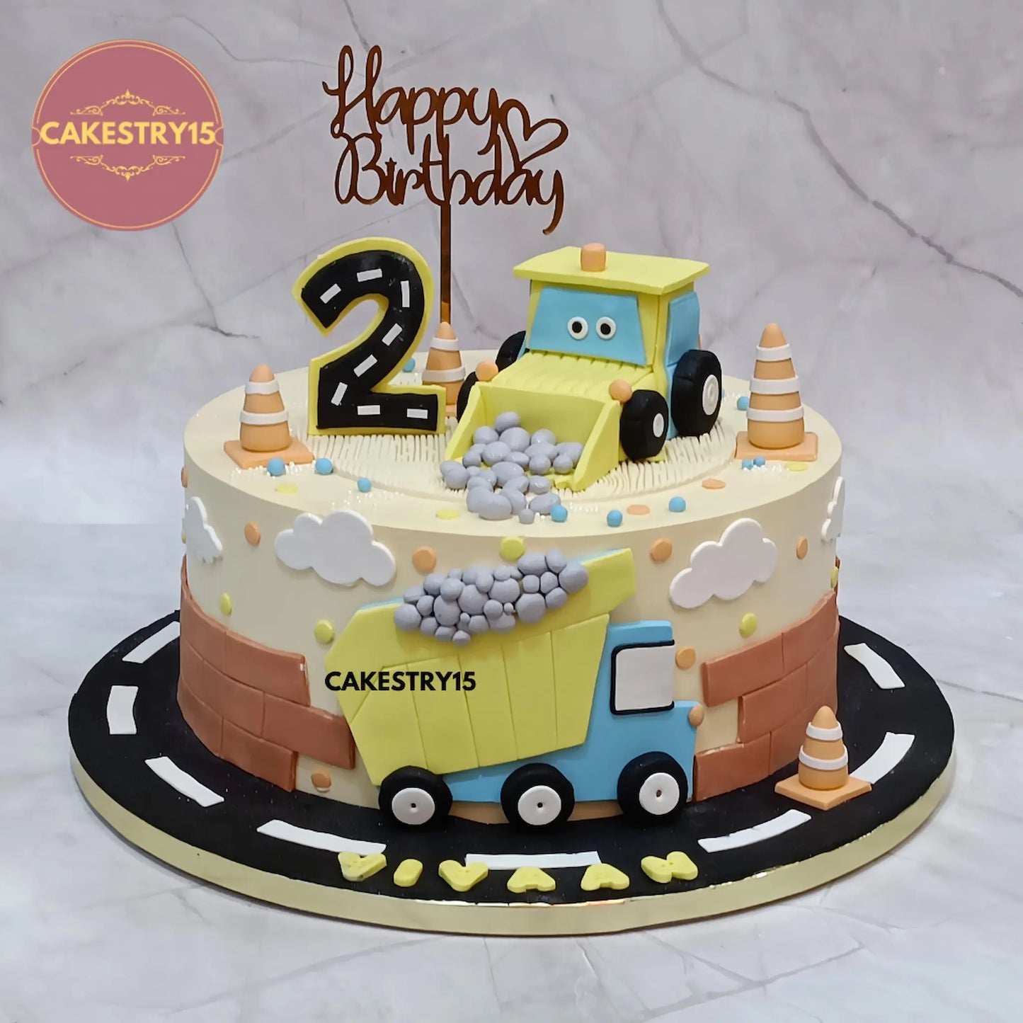 Eggless construction theme kids birthday cake for Vivaan’s 2nd birthday with fondant JCB and truck by Cakestry15 Noida