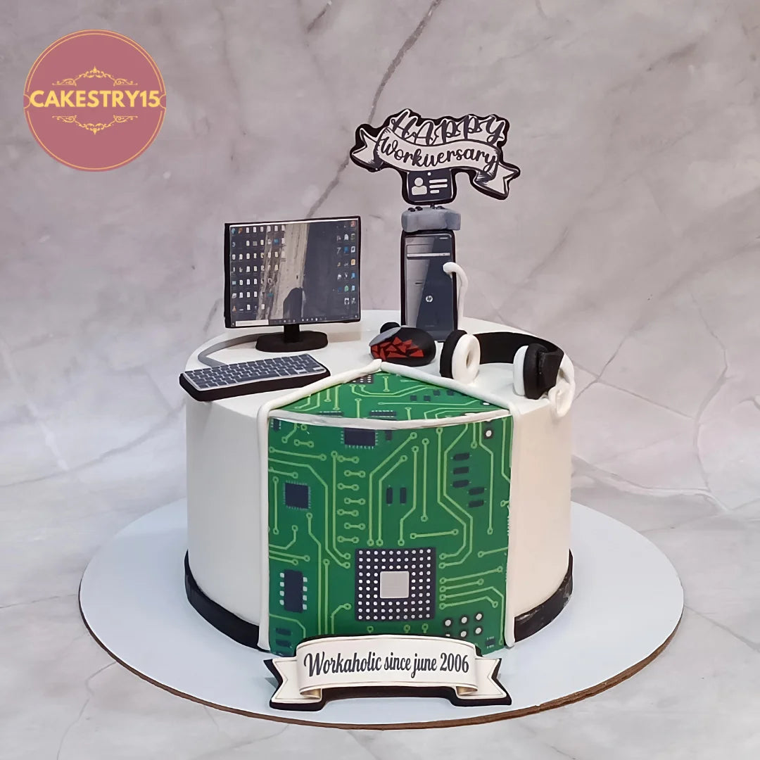 A corporate work anniversary kids birthday cake with a desk design, theme cake Noida styling and eggless cakes quality.
