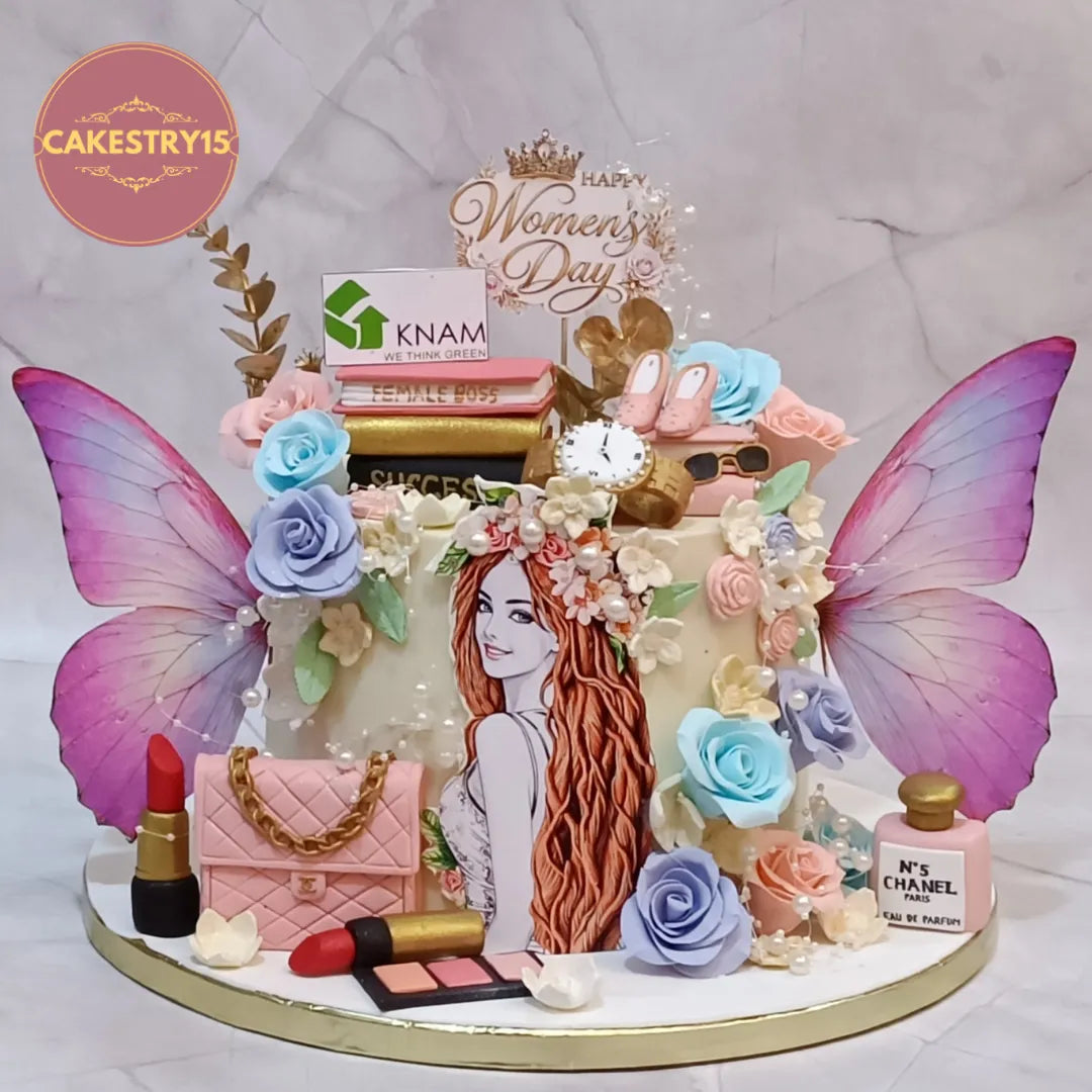 Designer eggless cakes with white ganache icing and fashion-inspired decorations for birthdays and womens day celebrations in Noida.