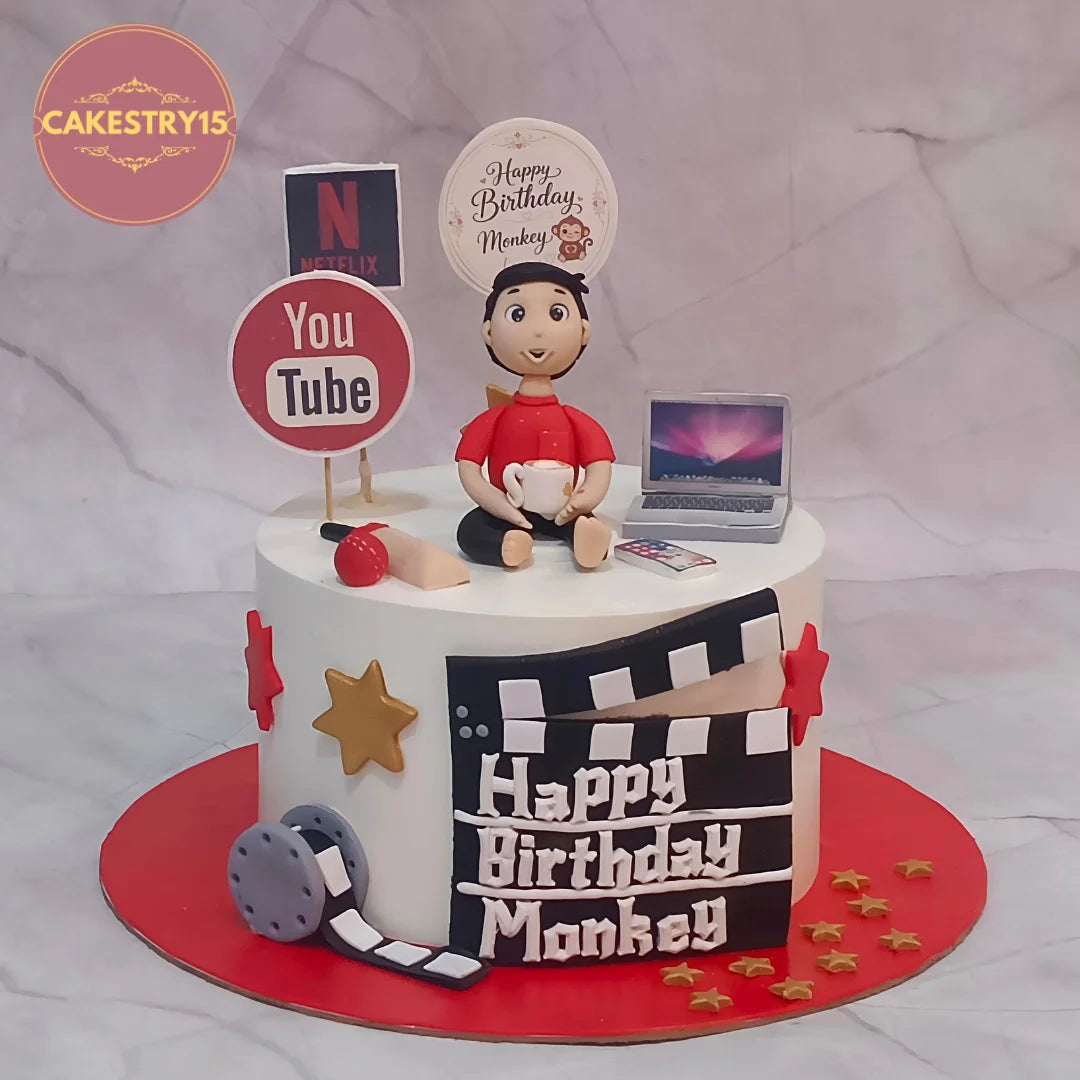 Digital Lifestyle mens birthday cake style theme cake Noida with laptop, movie and entertainment details, made with eggless cakes.