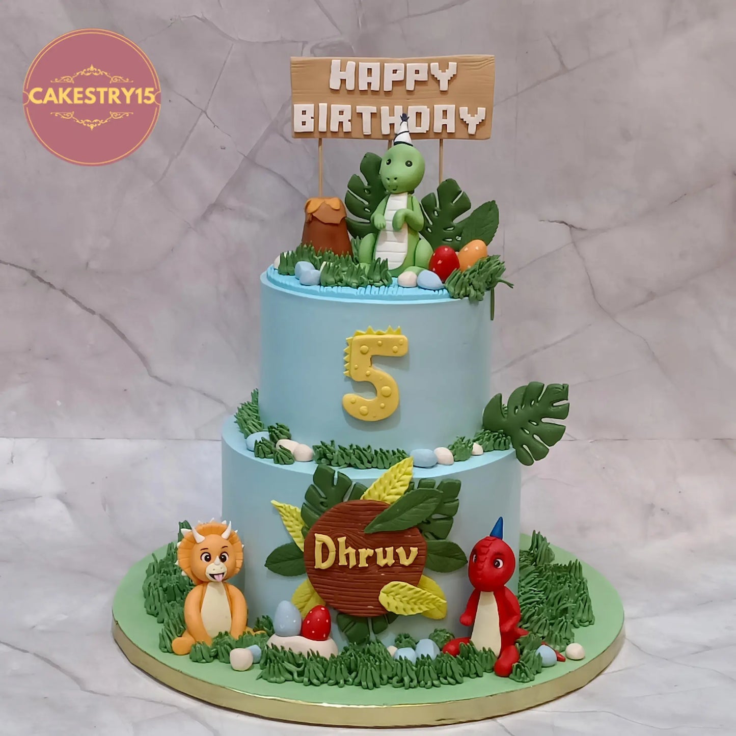 Dino theme jungle kids birthday cake for 5th birthday in choco butterscotch flavour, eggless custom cake in Noida