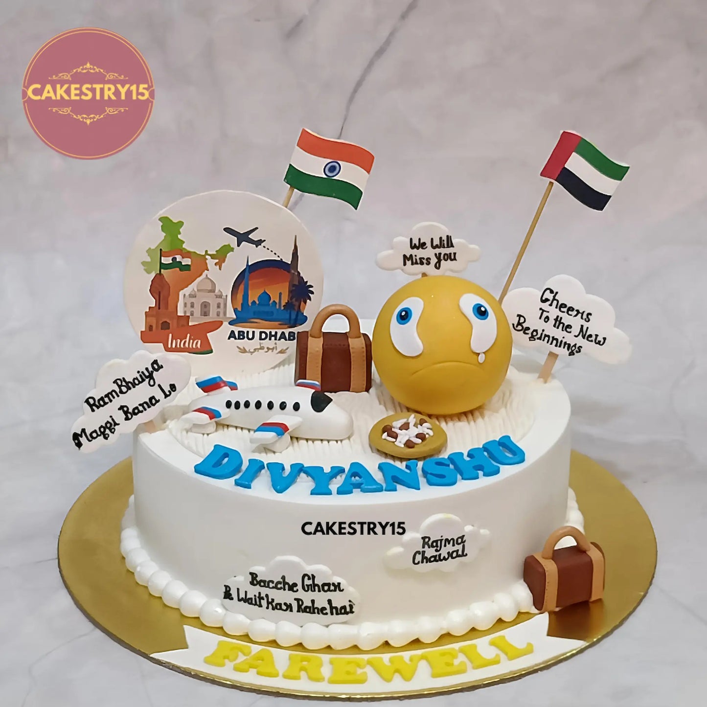 1kg pineapple farewell cake with fondant crying emoji, airplane, luggage, edible travel logo, flags, and farewell placards from Cakestry15 in Noida