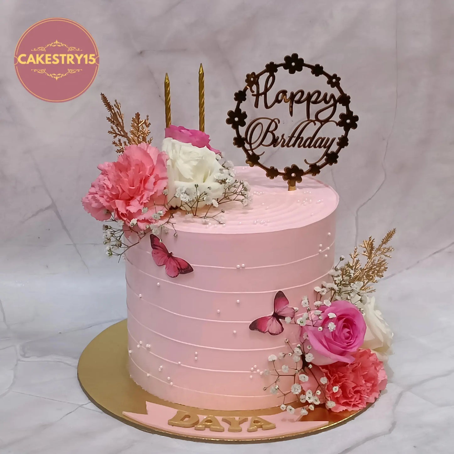 Floral theme eggless pineapple birthday cake with fresh roses and butterflies by Cakestry15 in Noida