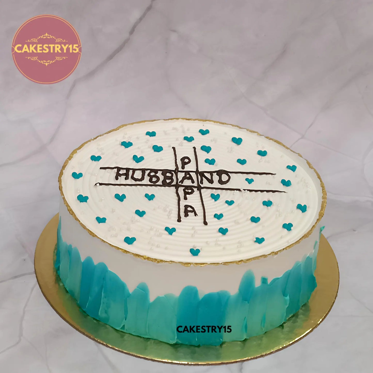 1kg eggless butterscotch cake with Papa and Husband text, golden rim, teal hearts from Cakestry15