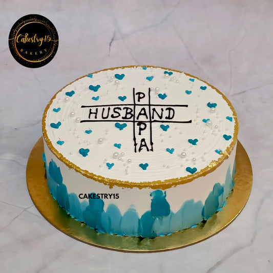 1kg eggless butterscotch cake with Papa and Husband text, golden rim, teal hearts from Cakestry15