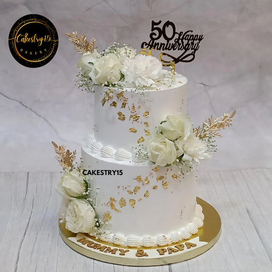 3kg pineapple 2-tier eggless anniversary cake with white roses, carnations, and golden foil from Cakestry15