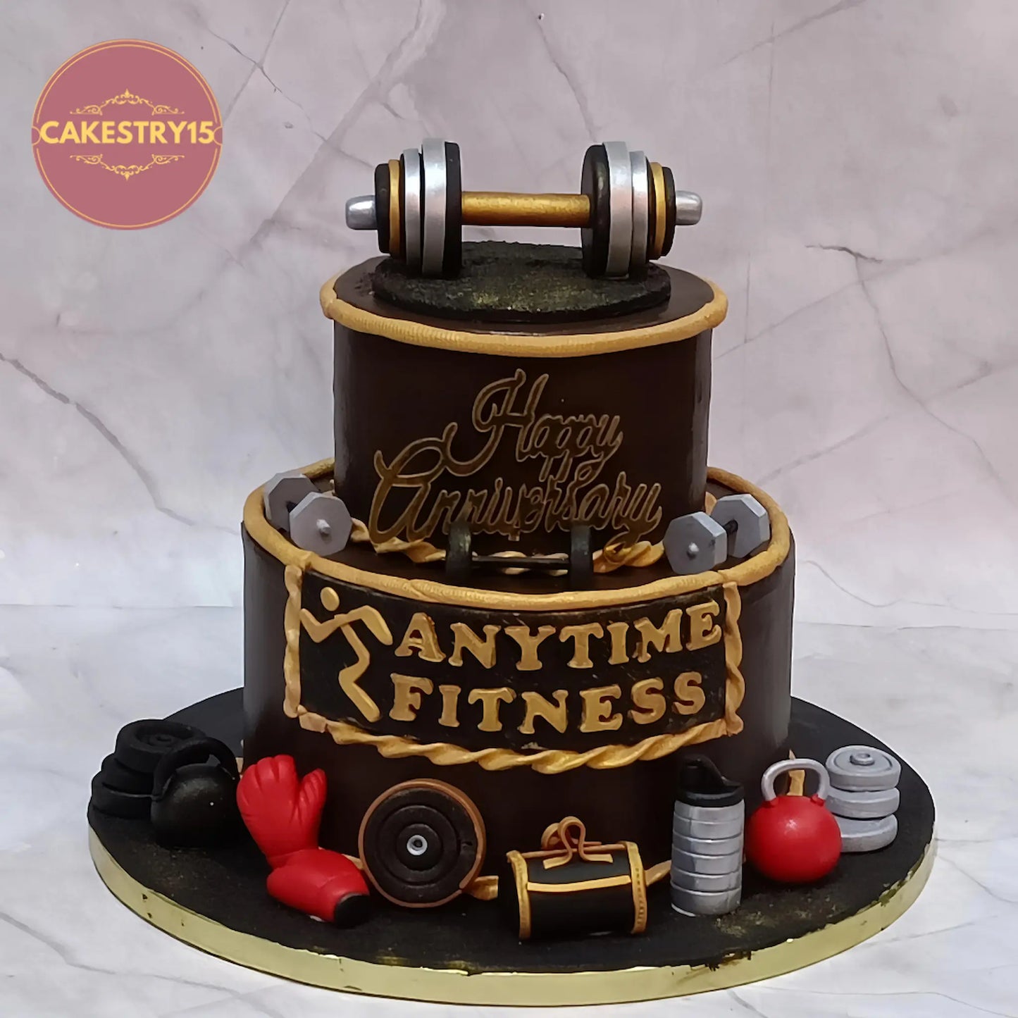 Gym theme anniversary cake with dumbbells, weights and boxing gloves in chocolate eggless design Noida