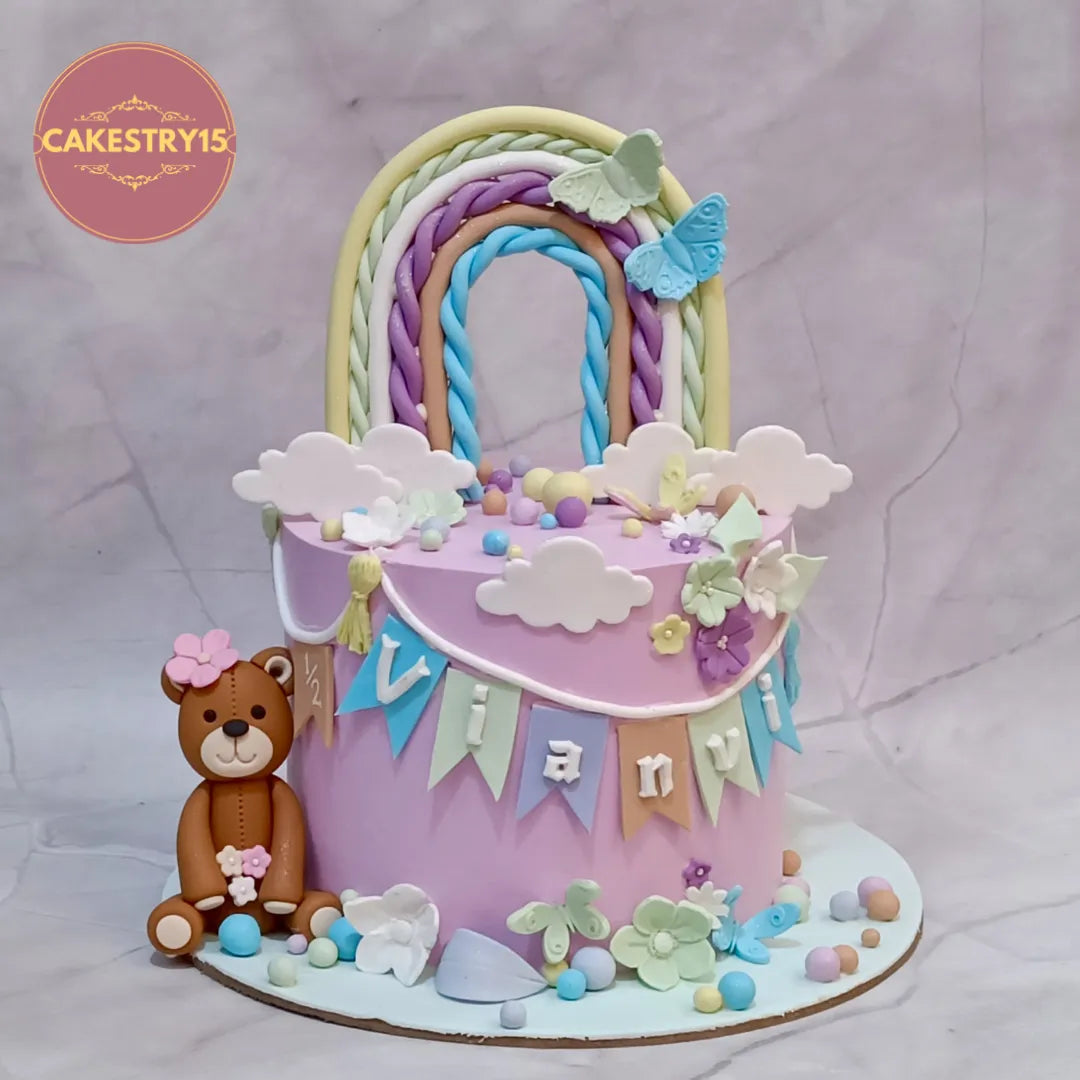 Eggless half birthday kids birthday cake with rainbow and teddy design, premium theme cake Noida by Cakestry15.